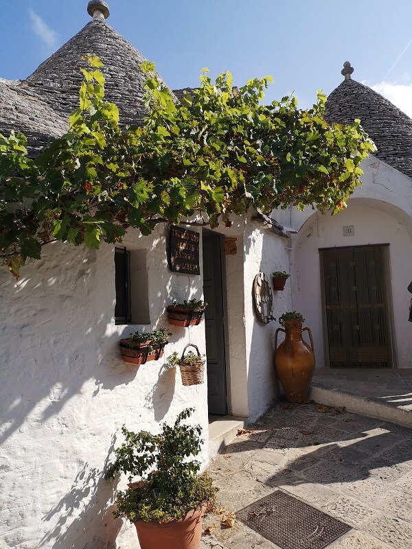 Trullo in Alberobello - detail of the whitewashed exterior and pointy roof