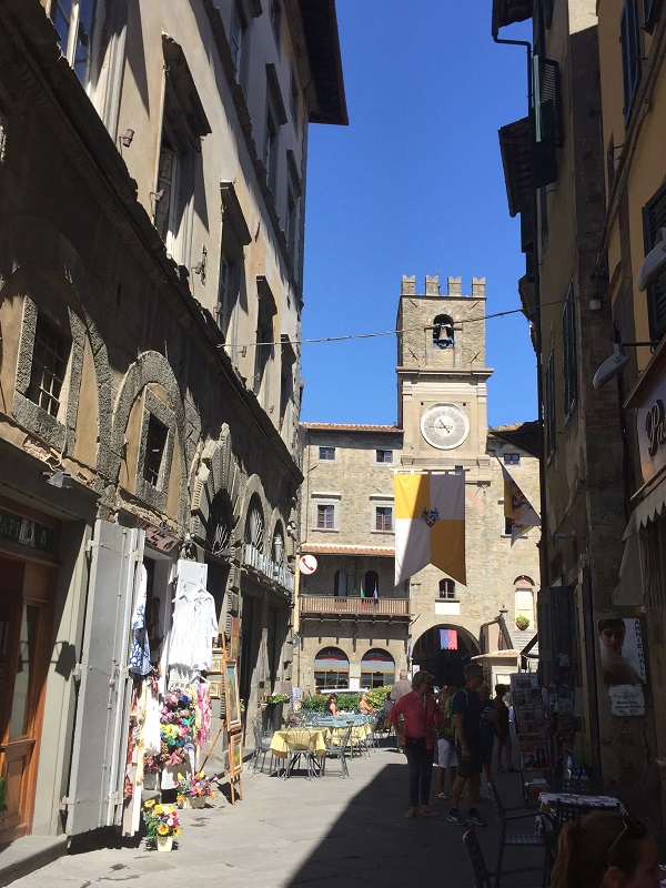 Cortona town center, with yellow and white checkered local flag