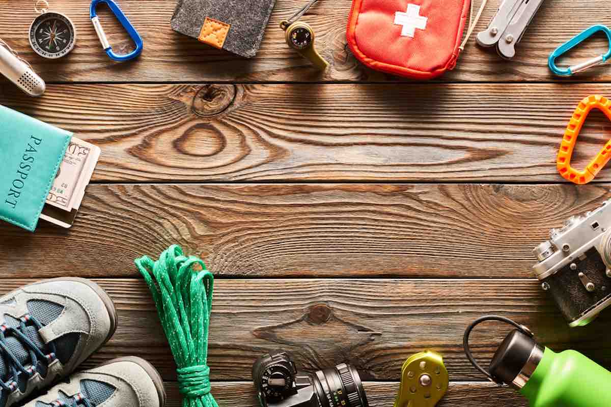 hiking essentials on wooden surface