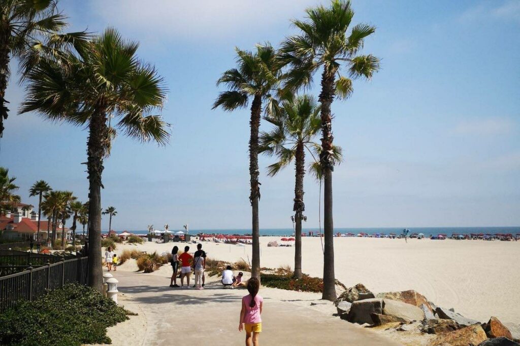 kid walking on Coronado Island boardwalk