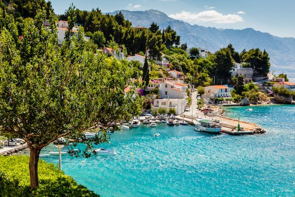 Seaside town in Croatia with small port and trees