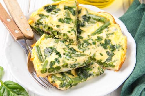 spinach and green beans frittata on white plate