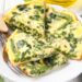 spinach and green beans frittata on white plate