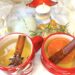 Hot toddy in Christmas mugs on Christmas table