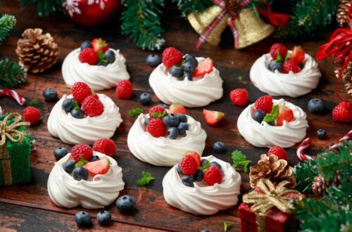 nests of meringues with fresh berries on Christmas table