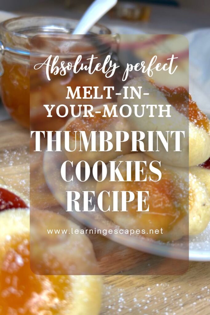 Photo of my homemade thumbprint cookies with overlay text: absolutely perfect melt-in-your-mouth thumbprint cookies recipe